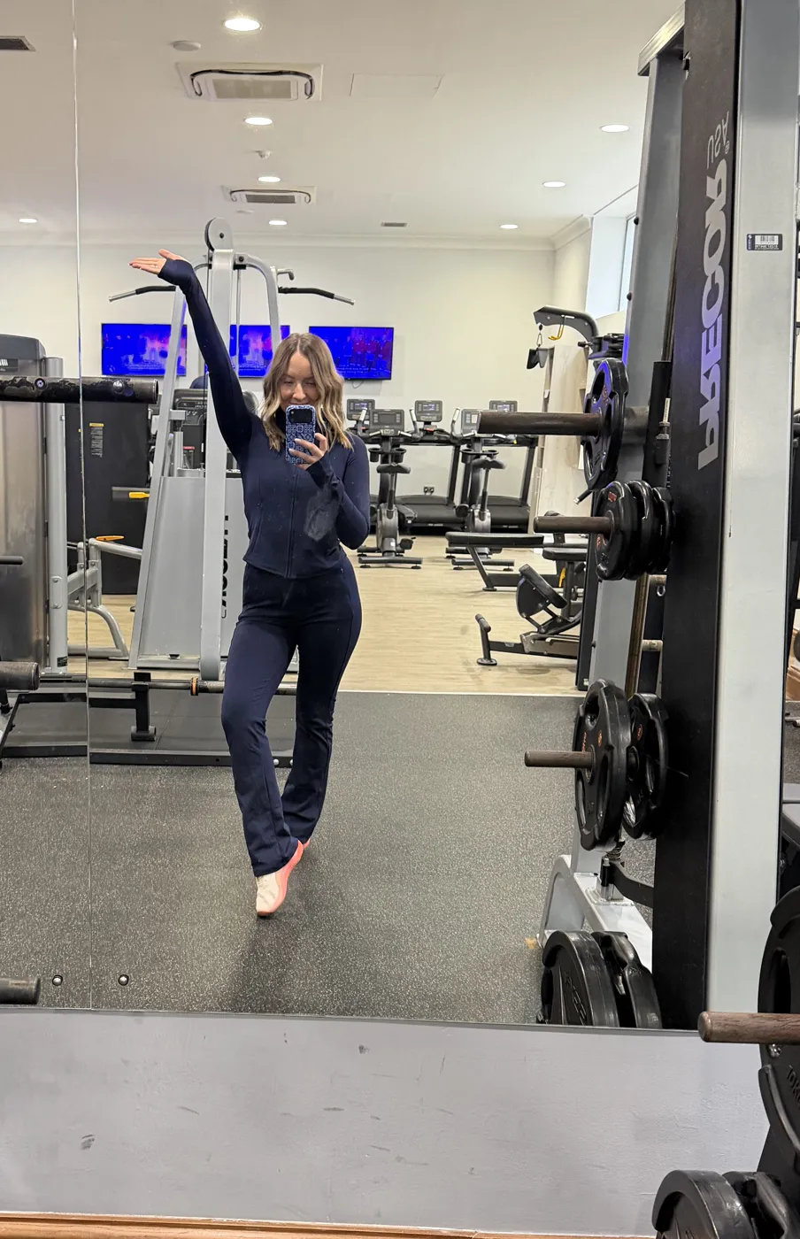 Claire striking a pose in the gym